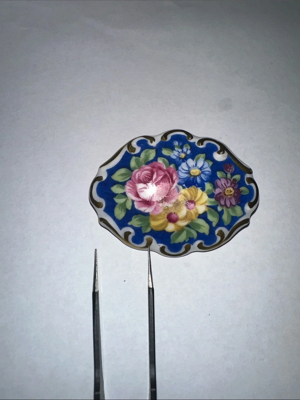 Floral ceramic Brooch with Gold tone Accents - Blue Background
